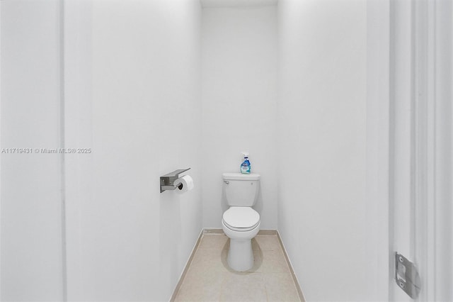 bathroom featuring tile patterned floors and toilet