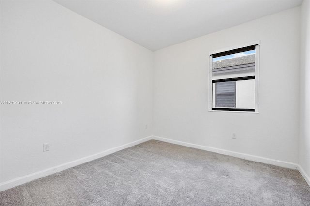 unfurnished room with carpet floors