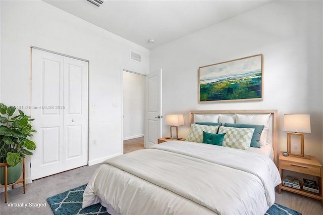 carpeted bedroom with a closet