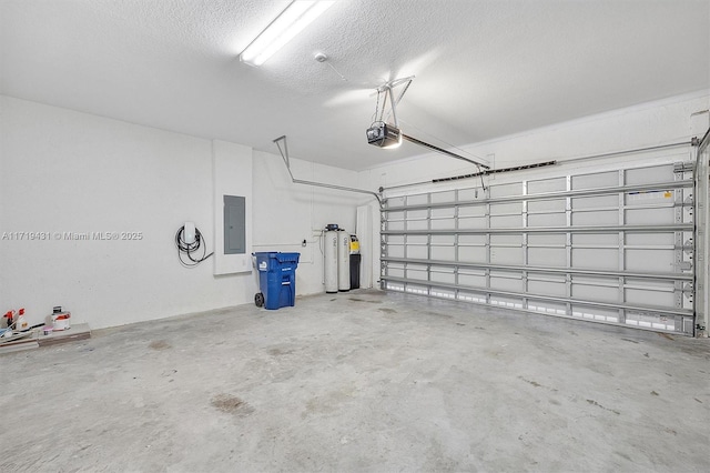 garage with a garage door opener and electric panel