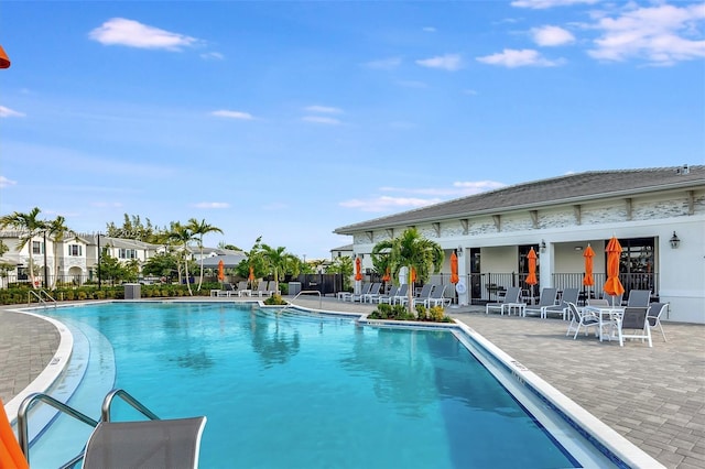 view of swimming pool featuring a patio area