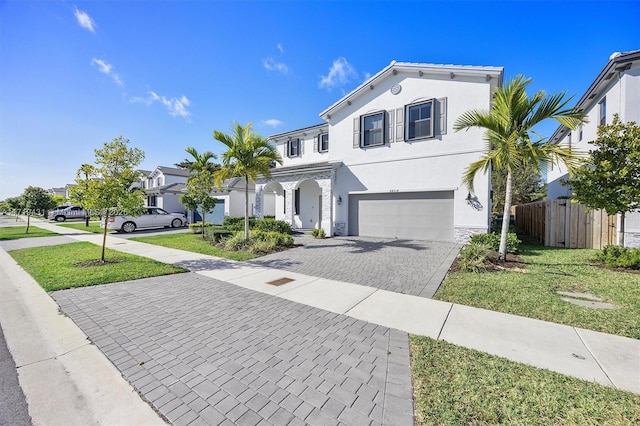 view of front facade featuring a garage and a front yard