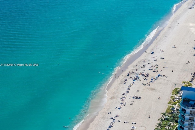 bird's eye view featuring a beach view and a water view