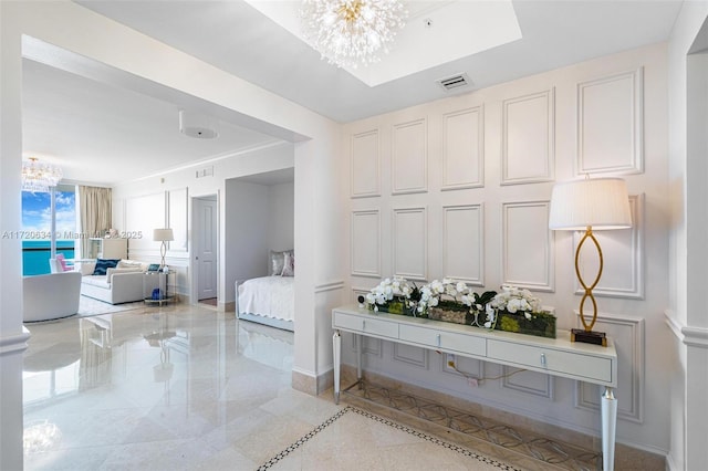 bedroom featuring an inviting chandelier