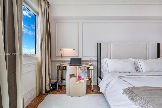 bedroom with a notable chandelier and ornamental molding