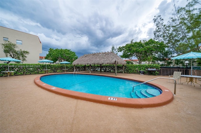 view of pool featuring a gazebo and a patio