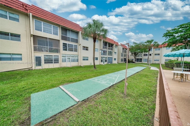 view of community featuring a lawn