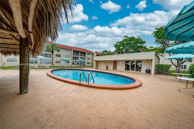 view of swimming pool with a patio area