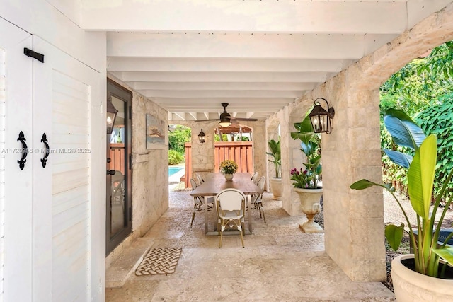 view of patio with ceiling fan and outdoor dining area