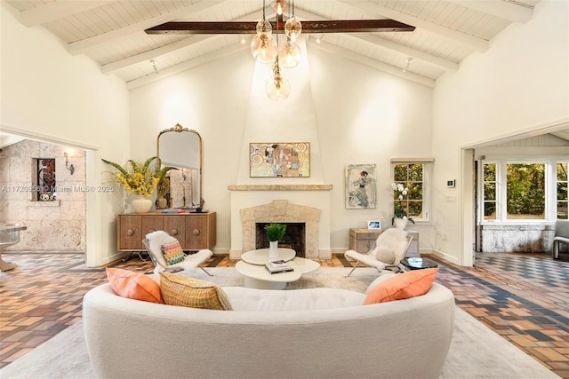 living room with brick floor, wood ceiling, a fireplace, and high vaulted ceiling