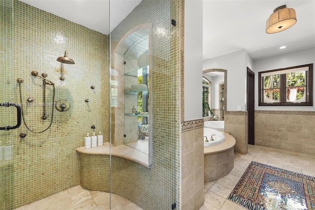 full bath featuring a bath, a stall shower, tile walls, and recessed lighting