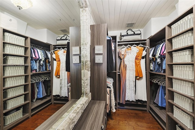 walk in closet with dark wood-style floors and visible vents