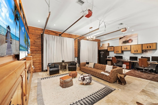 living area featuring recessed lighting, visible vents, and wooden walls