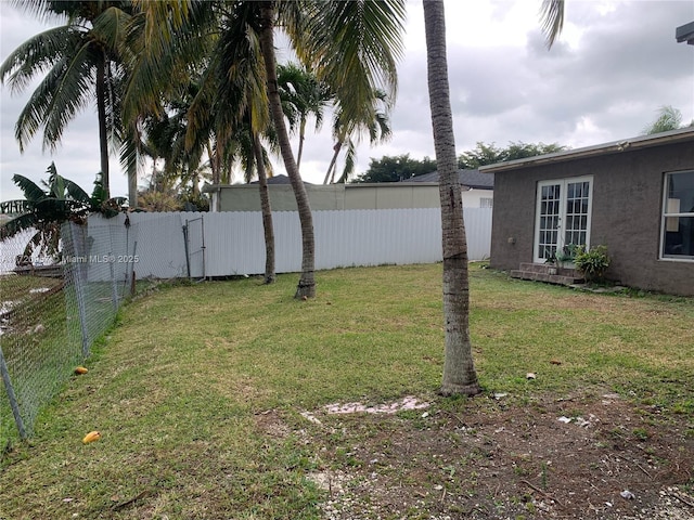 view of yard with a fenced backyard