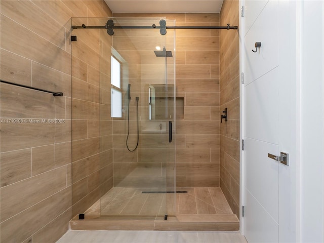 bathroom with a shower with shower door