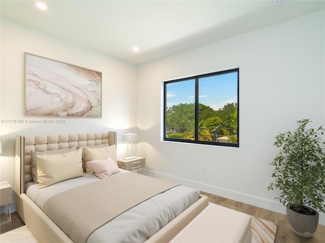 bedroom featuring hardwood / wood-style floors