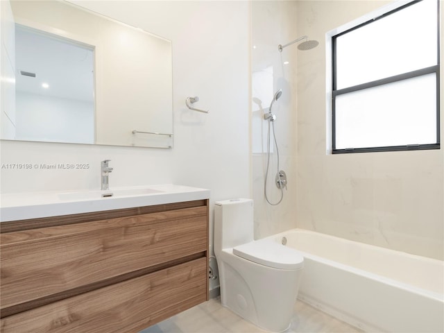 full bathroom with vanity, toilet, and tiled shower / bath