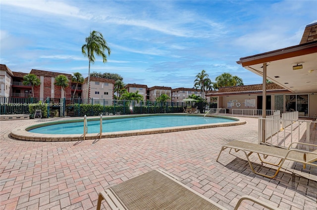 view of swimming pool featuring a patio area