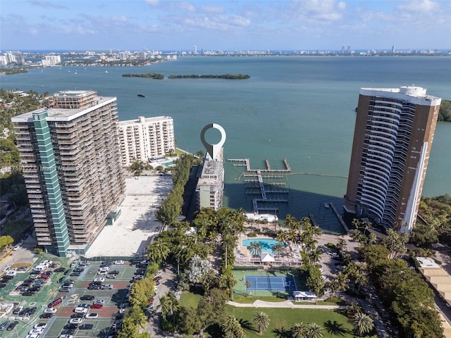 birds eye view of property with a water view