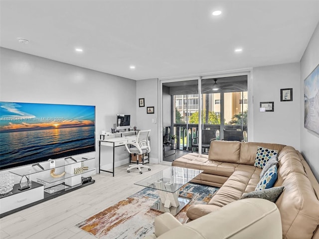 living room with light hardwood / wood-style flooring