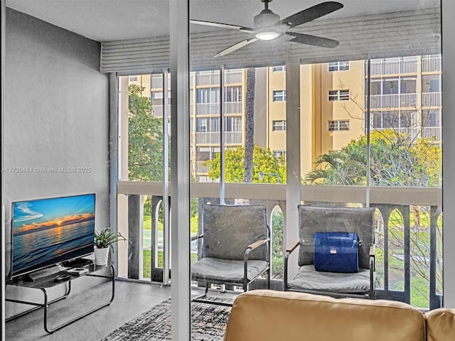 sunroom / solarium with ceiling fan