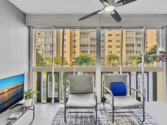 sunroom / solarium with ceiling fan