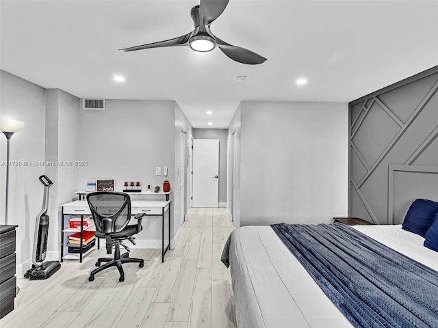 bedroom with light hardwood / wood-style flooring and ceiling fan