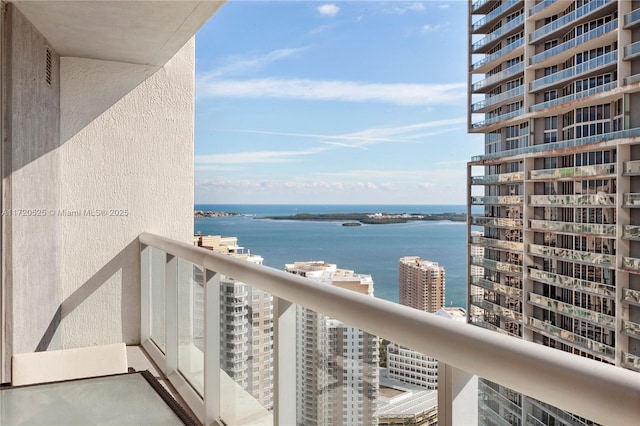 balcony featuring a water view