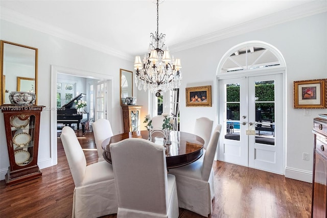 dining room with french doors, dark hardwood / wood-style floors, and crown molding