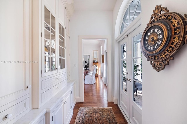 doorway to outside with dark hardwood / wood-style flooring and french doors