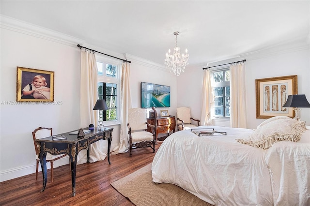 bedroom with crown molding, dark hardwood / wood-style flooring, and a notable chandelier