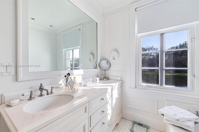 bathroom with tile patterned floors, crown molding, and vanity