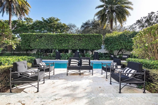 view of patio featuring a fenced in pool