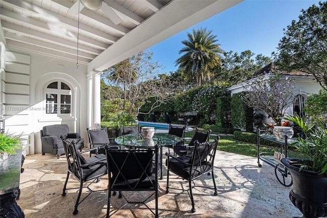 view of patio featuring ceiling fan