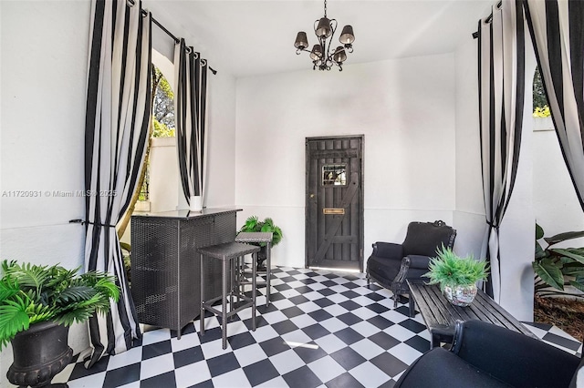 foyer entrance with an inviting chandelier