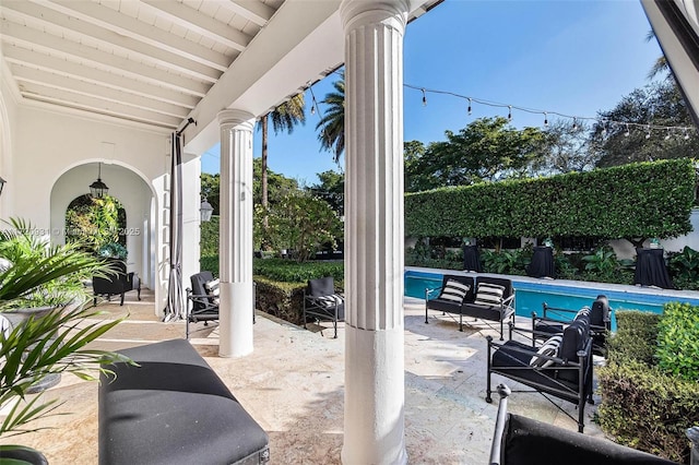 view of patio with a fenced in pool