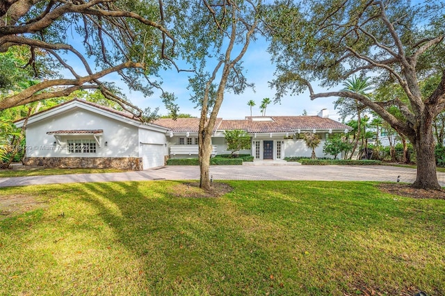 view of front of home featuring french doors and a front lawn