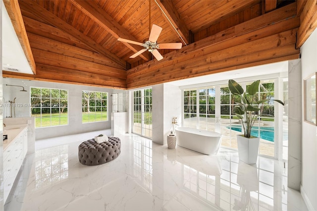 unfurnished sunroom with vaulted ceiling with beams, ceiling fan, and wooden ceiling