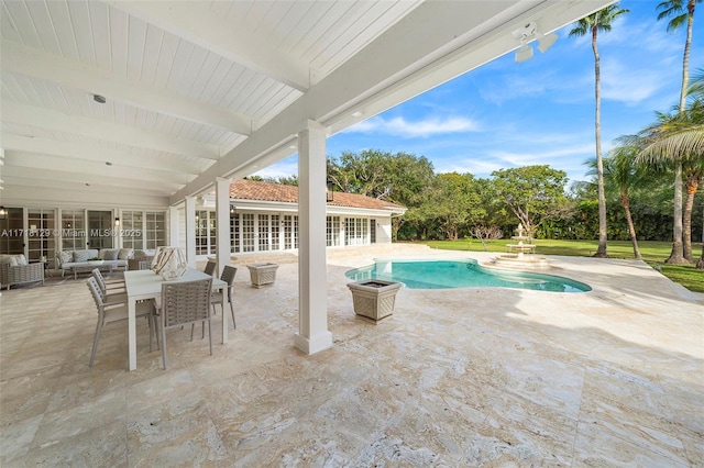 view of swimming pool with an outdoor living space and a patio