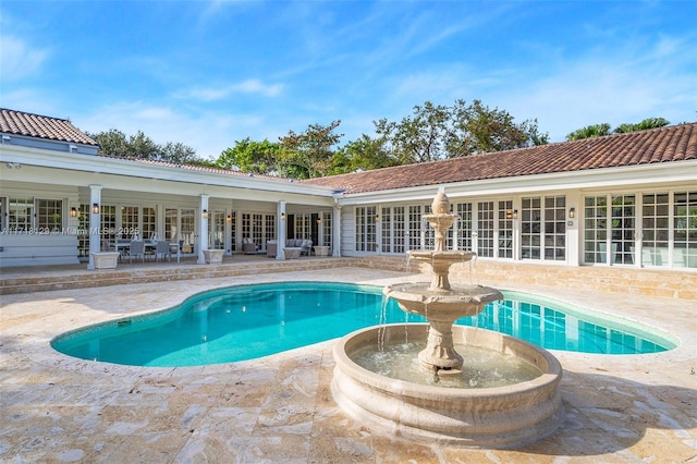 view of swimming pool featuring a patio