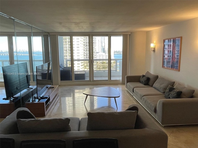 living room featuring a wall of windows