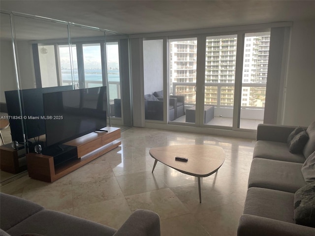 living room featuring a wall of windows