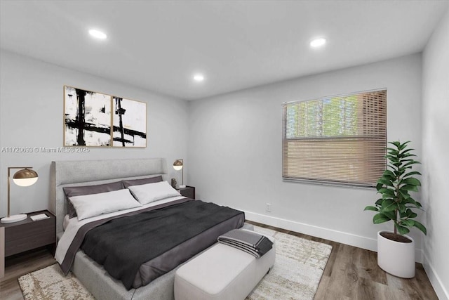 1201 SW 128th Ter Unit 303E, Pembroke Pines, FL 33027 - bedroom with wood finished floors, baseboards, and recessed lighting