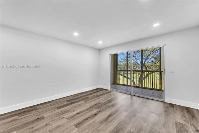 unfurnished room featuring light hardwood / wood-style floors