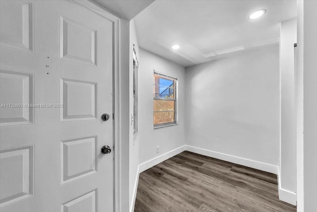 empty room with dark wood-type flooring