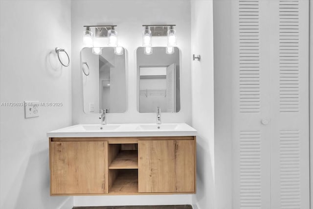 1201 SW 128th Ter Unit 303E, Pembroke Pines, FL 33027 - bathroom with a closet, double vanity, and baseboards