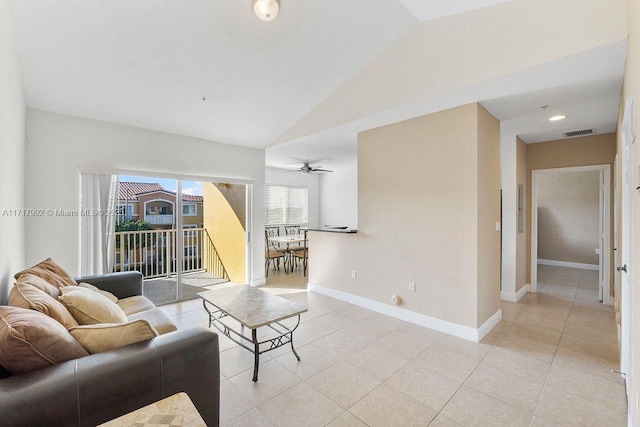 living room with light tile patterned floors, ceiling fan, and lofted ceiling