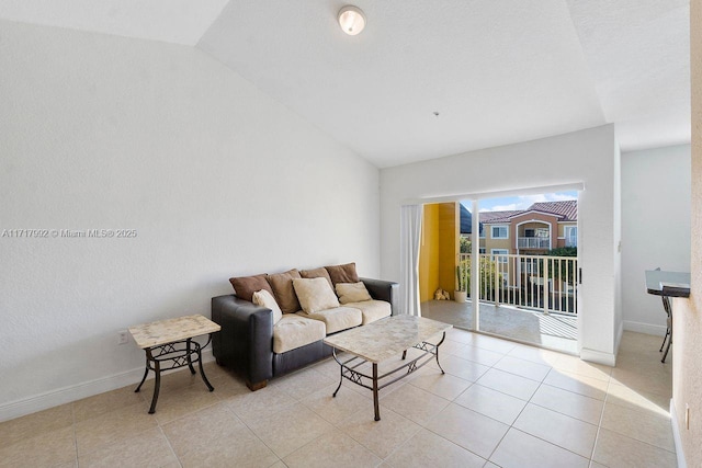 tiled living room with lofted ceiling