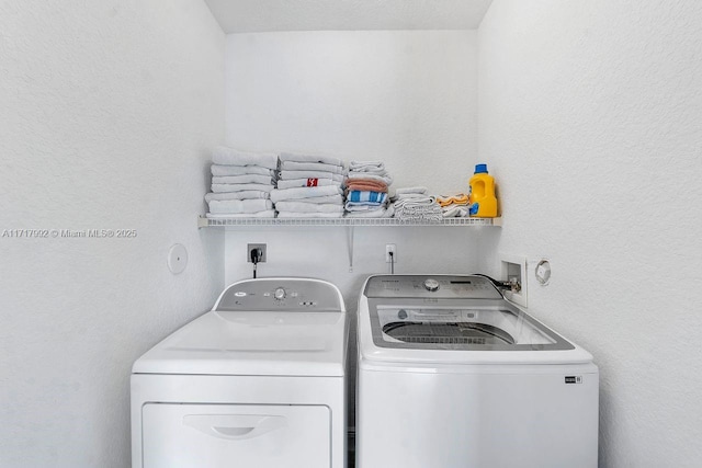 laundry room featuring washing machine and dryer