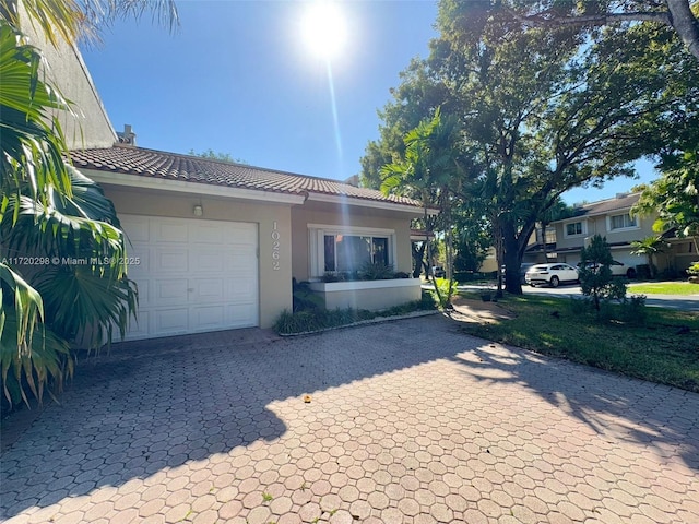 view of front of property with a garage